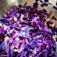 Wilted cabbage, navy bean, cheddar in pomegranate vinaigrette